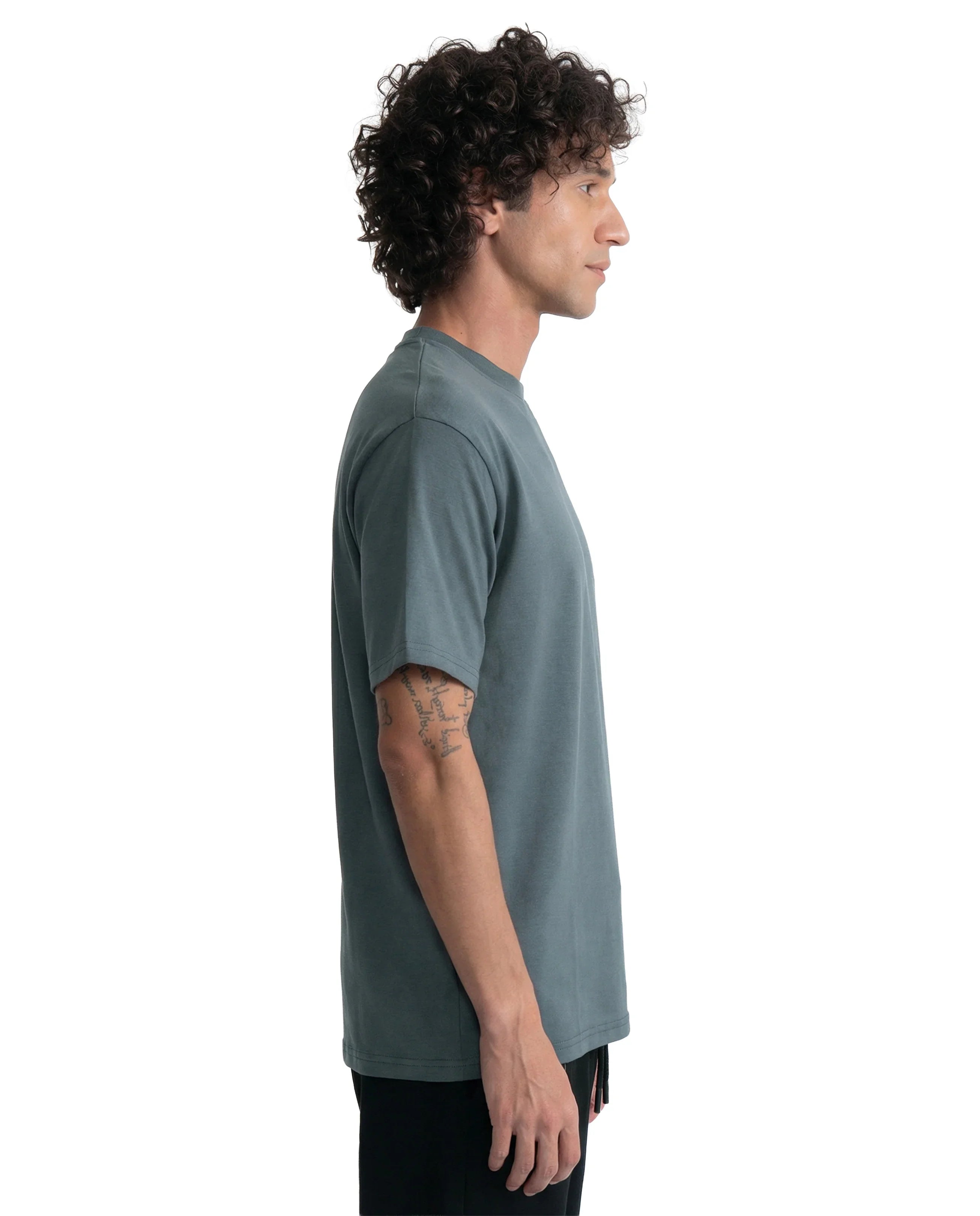 Man wearing a plain gray t-shirt on a white background