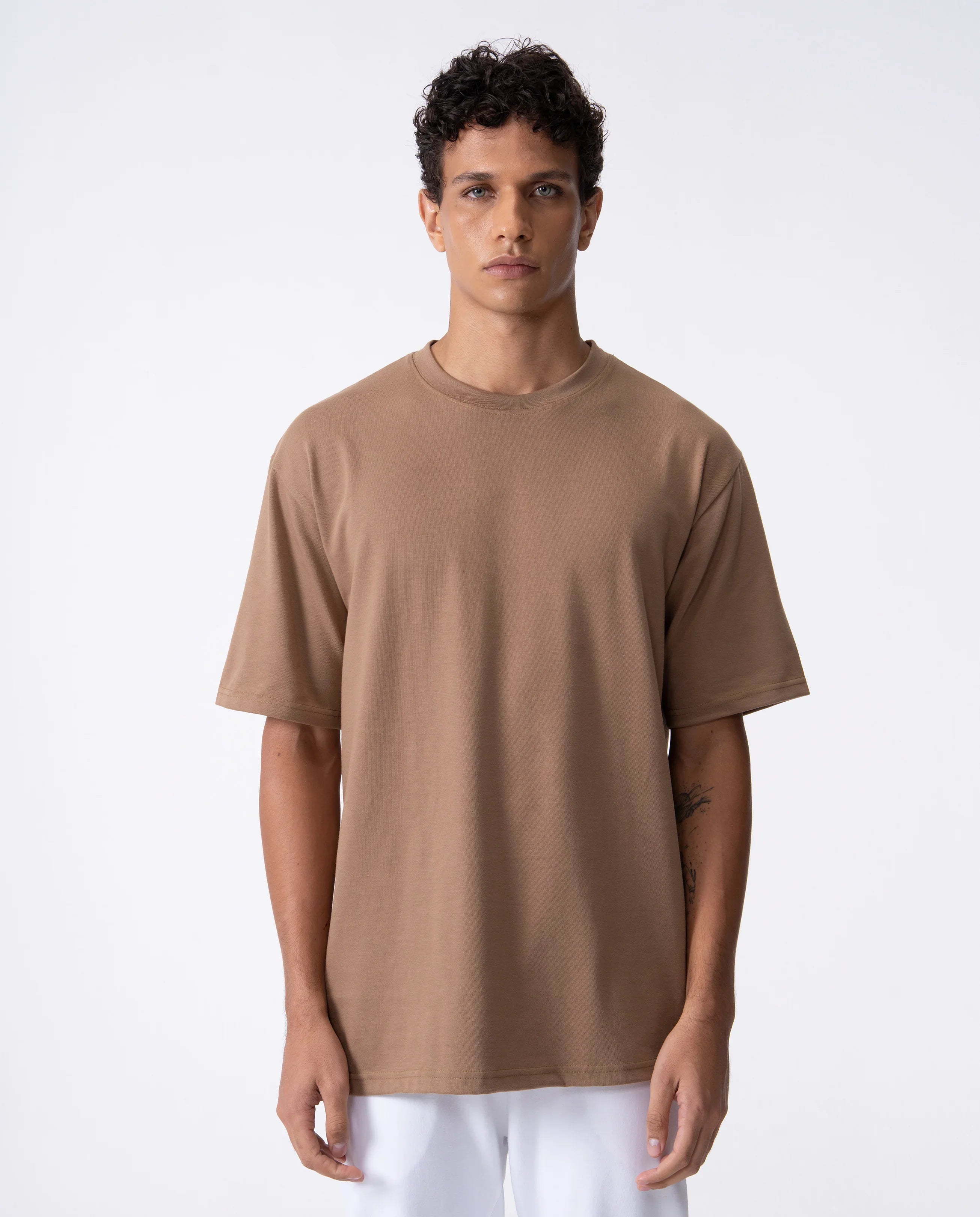 Man wearing a brown t-shirt on a white background