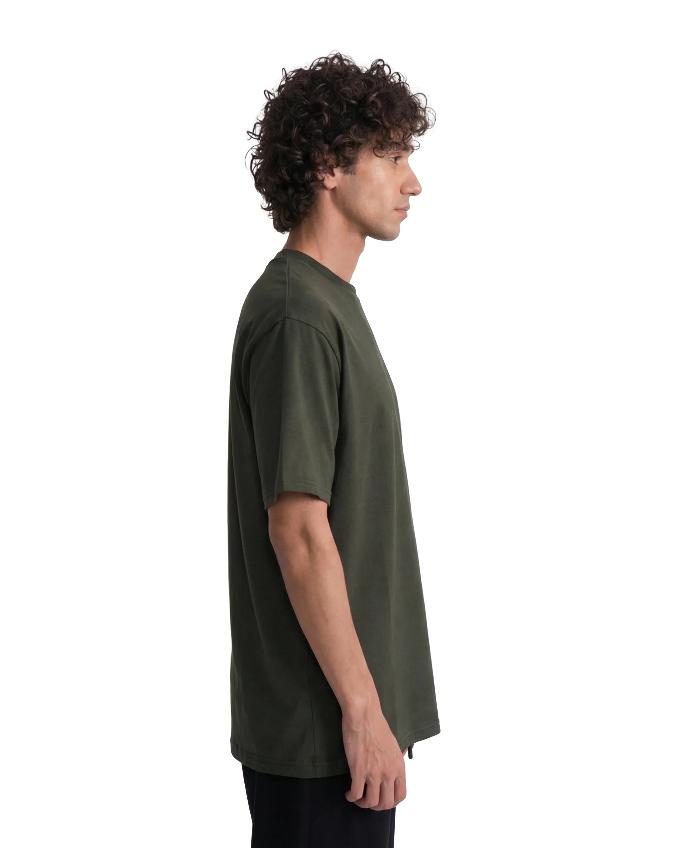 Man wearing a green t-shirt on a white background