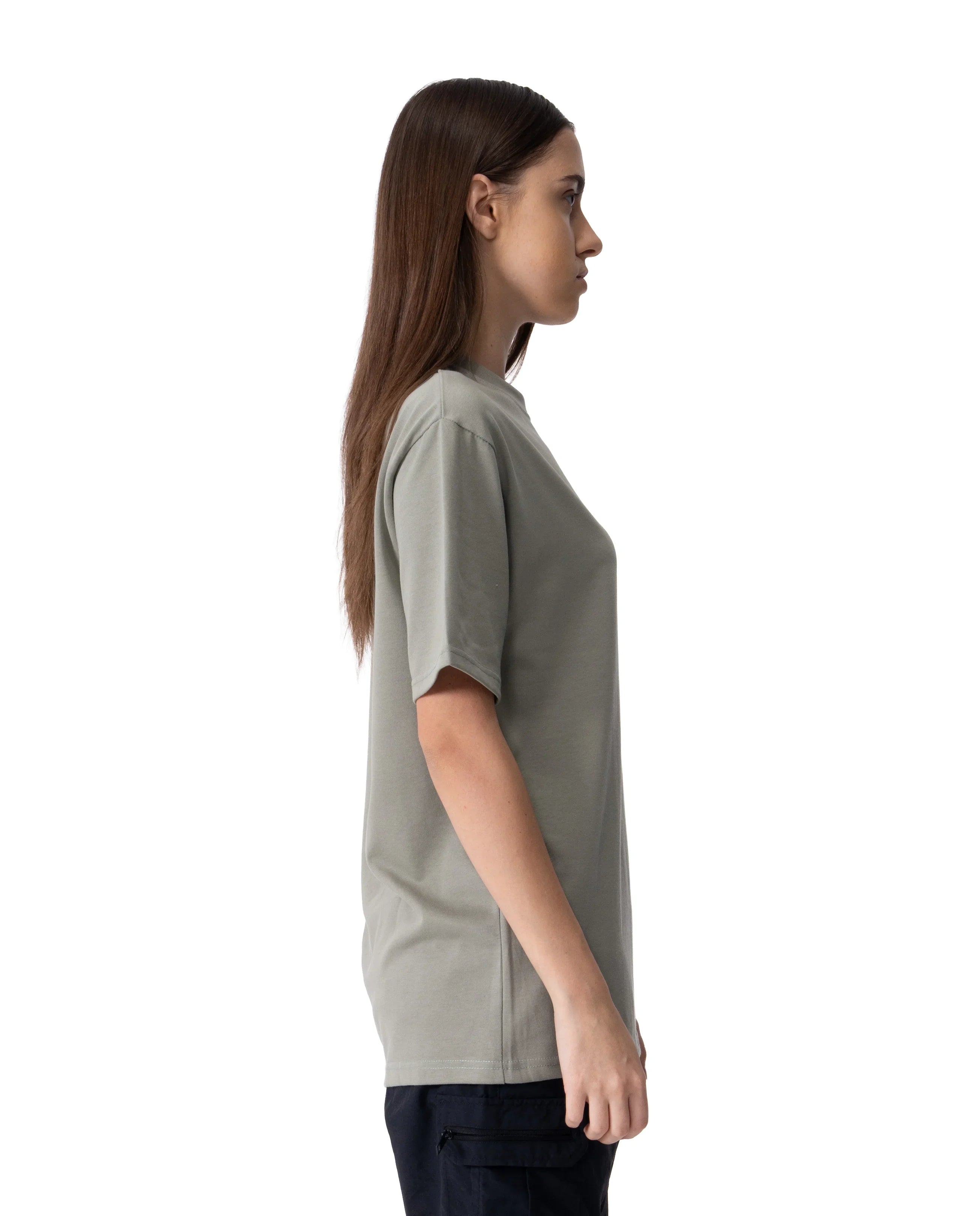 Woman wearing a plain gray t-shirt on a white background