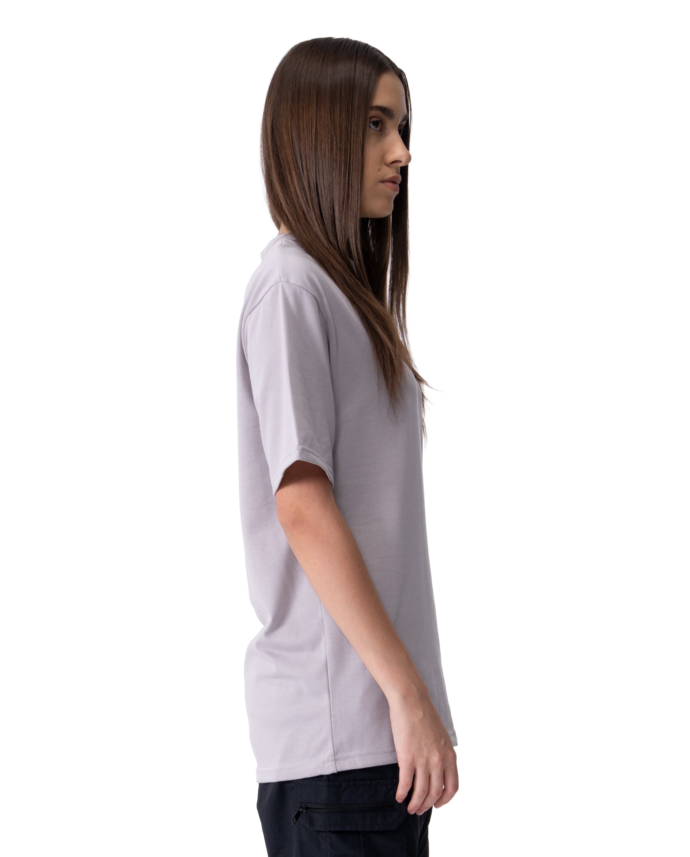 Person wearing a light gray t-shirt on a white background