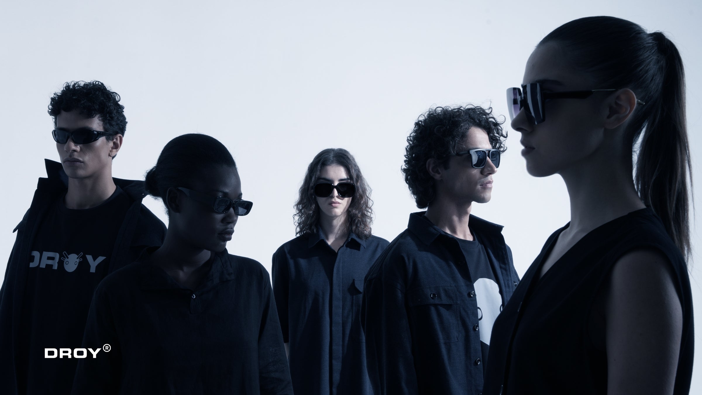 Five people wearing sunglasses with a brand logo on a white background