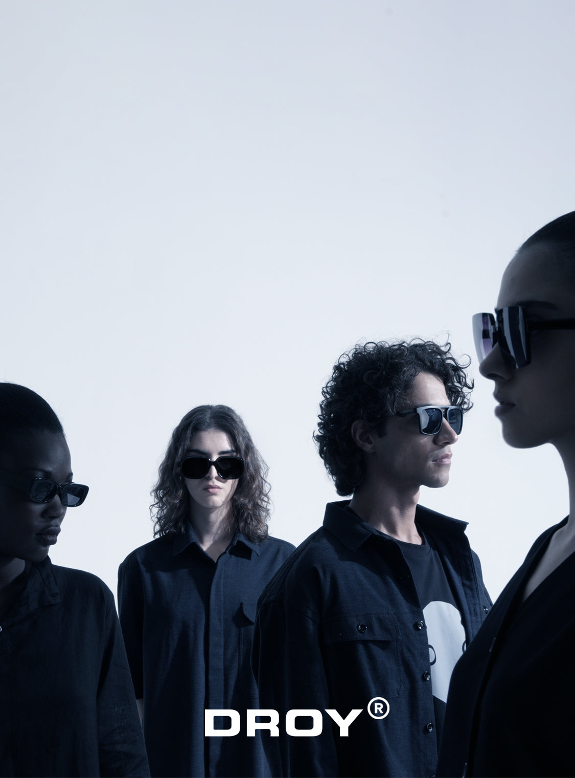 Four people wearing sunglasses with 'DROY' logo on a white background