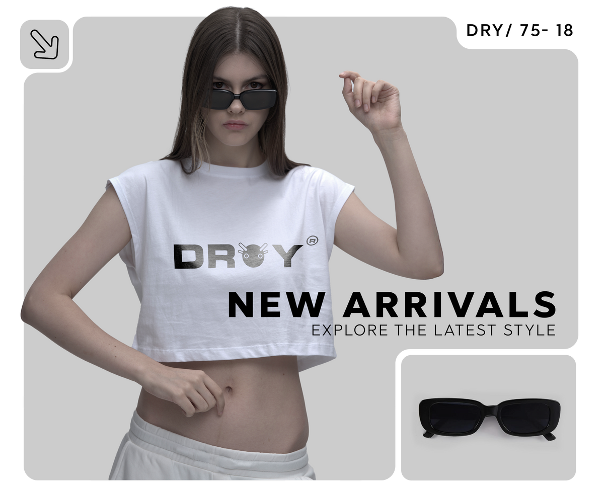 Woman wearing a white crop top with 'DROY' branding and sunglasses, on a gray background.